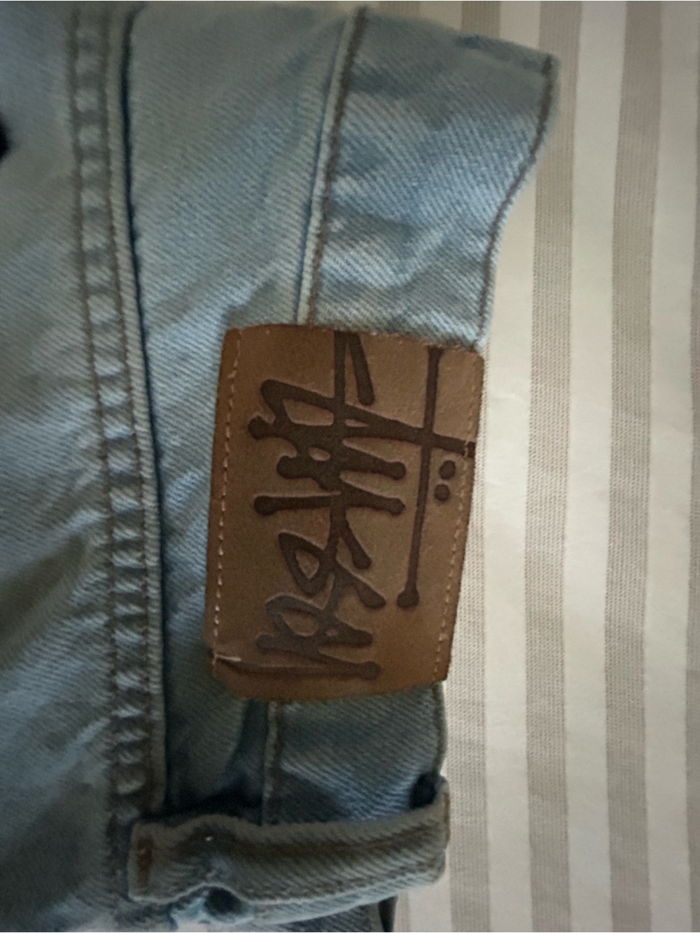 Stussy Light Blue Denim Jeans with Brown Leather Patch